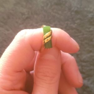 Gold tone, green stone ring. I believe it's jade, but I'm not positive. Size 6